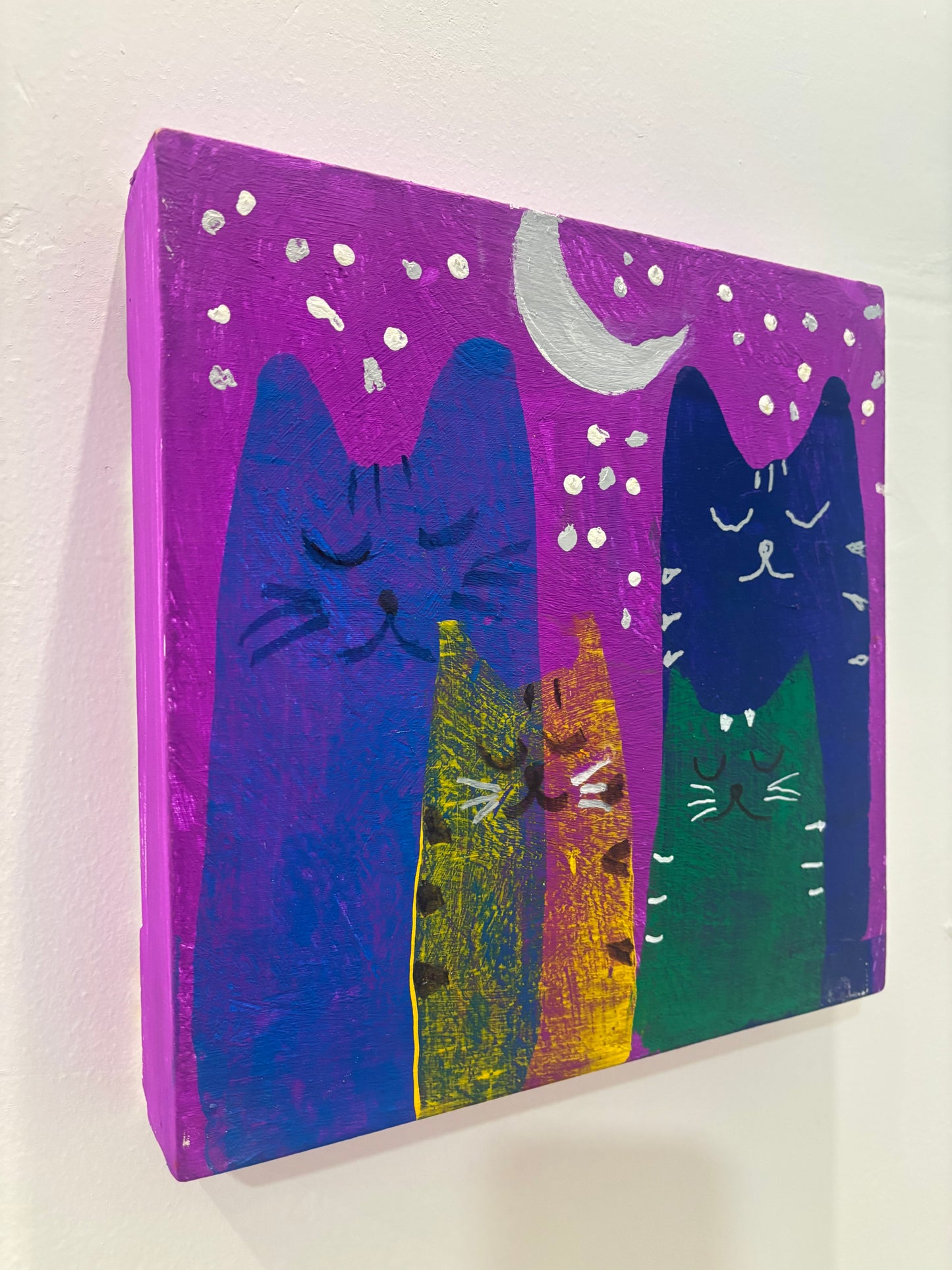 Gatos bajo la Luna